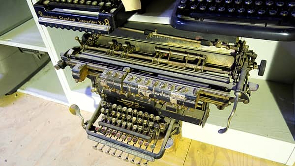 Columns of handwritten figures in a bound ledger book photographed from directly above under even light